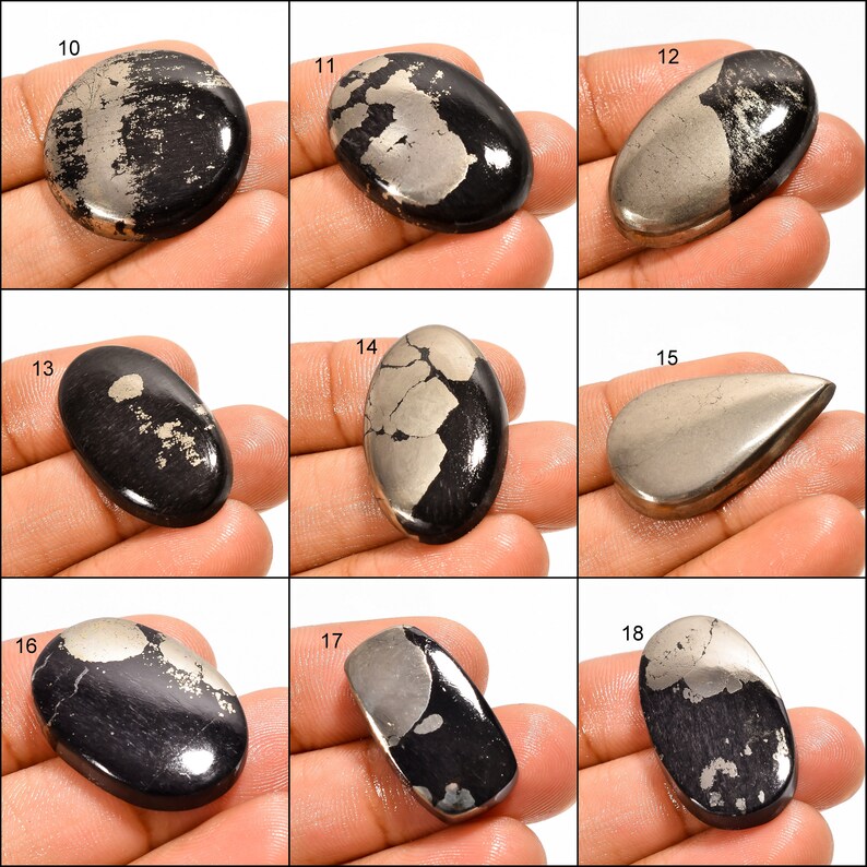 May include: Nine oval and teardrop shaped cabochons of black and silver pyrite, with varying patterns and sizes.