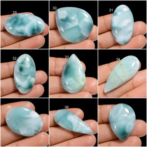 May include: Nine cabochon gemstones, each with a unique swirling pattern of blue, green, and white. The stones are numbered 29 through 37.