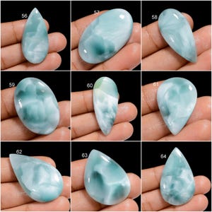 May include: A collection of 10 cabochon gemstones, each with a unique blue and green marbled pattern. The stones are all pear-shaped and have a smooth, polished finish.