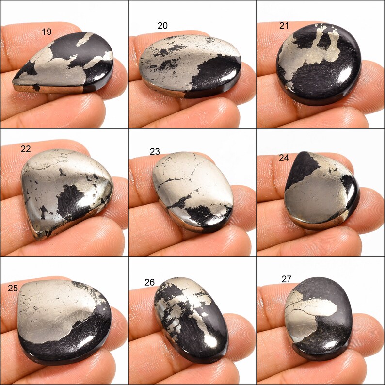 May include: Nine cabochon gemstone cabochons, each with a unique pattern of silver and black pyrite. The cabochons are numbered 19 through 27.