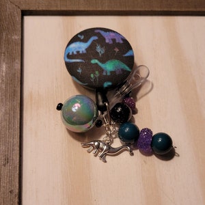 Dinosaur Badge Reel