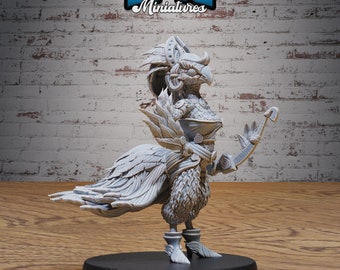 Op de afbeelding: Een grijs, gedetailleerd miniatuur van een vogelachtig wezen met gevederde vleugels, dat een gevederde hoofdtooi draagt en een boog en pijl vasthoudt. Het miniatuur staat op een zwarte basis met de tekst "BASE SIZE: MEDIUM (25.5MM)" en "#3792".