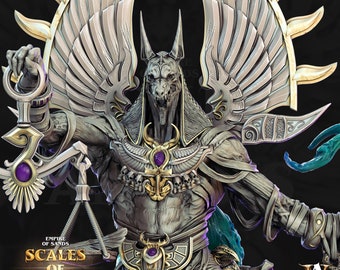 May include: A detailed, 3D printed miniature of Anubis, the Egyptian god of the dead, holding scales. He is depicted as a jackal-headed humanoid with wings and a golden collar. The miniature is part of the "Scales of Anubis" game.