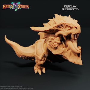 May include: A pre-supported 3D printed miniature of a Squigjaw, a fantasy creature with a large mouth, sharp teeth, and a scaly body. The miniature is painted in a light brown color.
