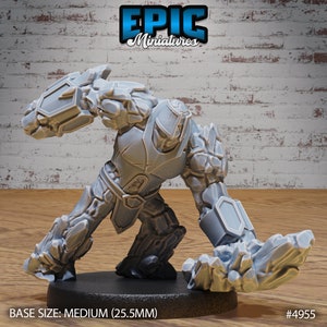 May include: Gray 3D printed miniature of a stone golem with a medium base size of 25.5 mm. The golem is in a fighting pose with its arms raised and fists clenched. The miniature is made of a smooth, gray plastic.