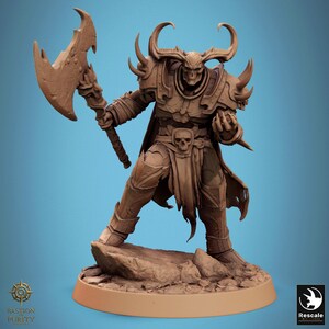 May include: A brown figurine of a horned warrior holding a large axe. The warrior is wearing armor and a cape, with a skull on the belt. The figurine is on a small rock base. The text "Bastion Purity" is visible.