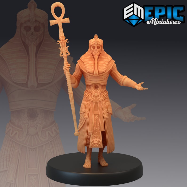May include: A detailed miniature figurine of an Egyptian pharaoh, painted in a light brown color. The pharaoh is wearing a traditional headdress and holding a staff with an ankh symbol at the top.