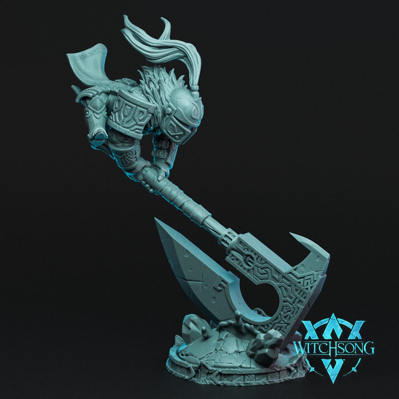 May include: A gray 3D printed miniature of a warrior with a long axe. The warrior is wearing armor and a helmet with a horned headdress. The axe is decorated with intricate carvings. The miniature is standing on a rocky base with the text "WITCHSONG" printed on it.