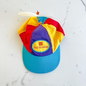 Vintage FAO Schwarz-spin-tophoed, colorblock-ontwerp, Toy Store-hoed, geschikt voor kinderen en volwassenen