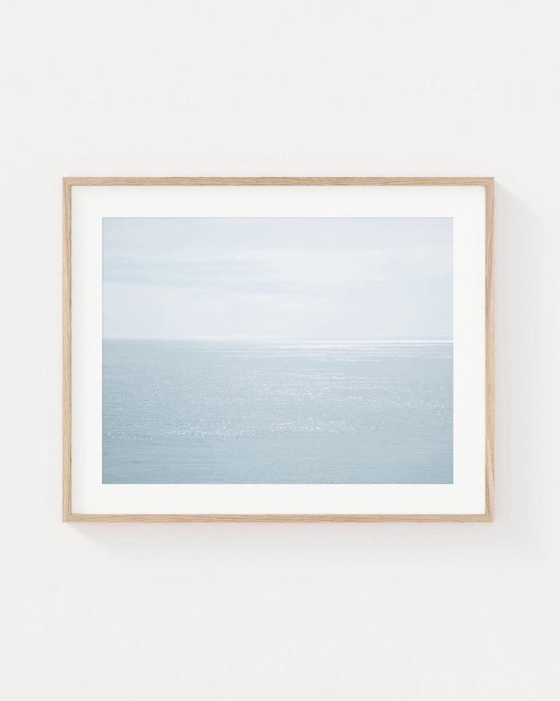 Abstract ocean reflection wall art with soft neutral water tones in a minimal coastal composition.