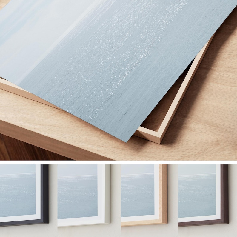May include: A framed print featuring a seascape in shades of blue and white. The print is displayed in a natural wood frame, with a close-up showing the texture of the artwork and the frame's construction. Additional frames in black, white, and brown are also shown.