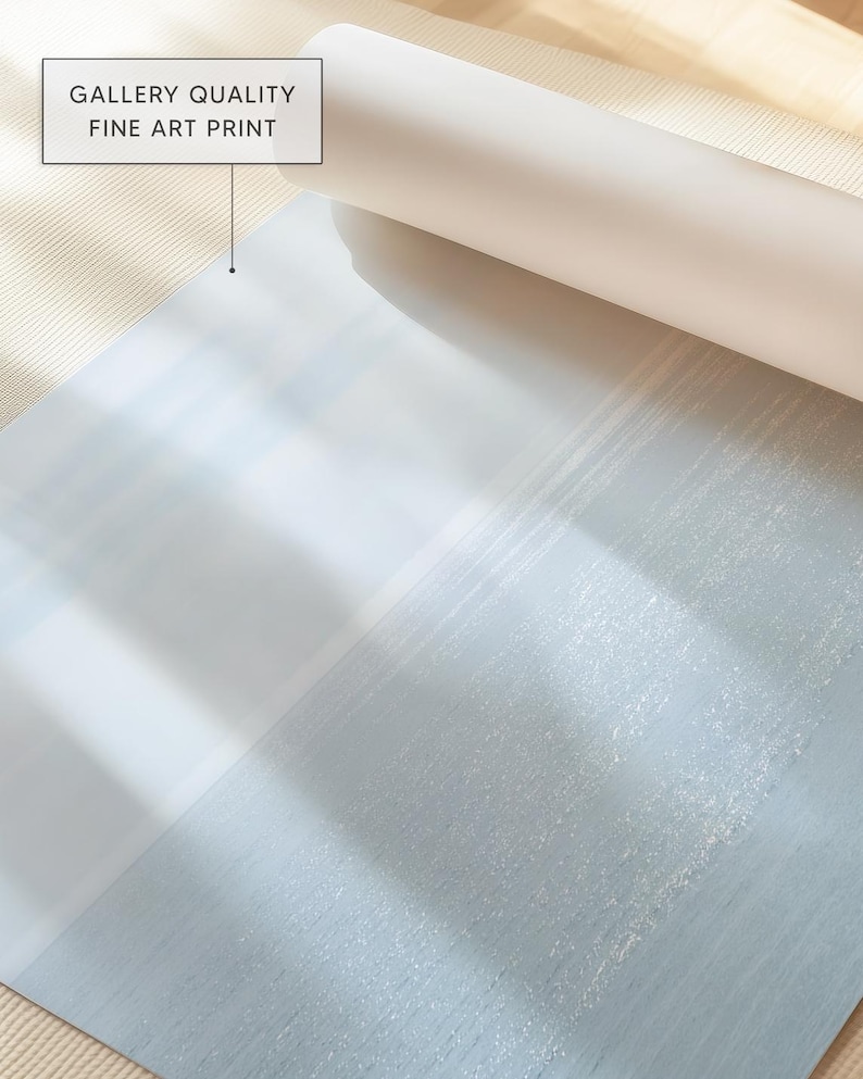 May include: A rolled-up white fine art print with the text "GALLERY QUALITY FINE ART PRINT" in a white box. The print has a light blue and white abstract design.
