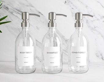 Lot de trois bouteilles en verre transparent pour shampooing et shampooing nettoyant pour le corps - Distributeur rechargeable et pompe avec étiquette imperméable blanche | Respectueux de l'environnement