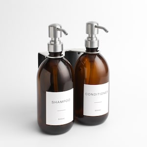 Wall Mounted Amber Glass Dispensers Set of Two - Premium Stainless Steel Double Silver Bracket Bottle Holder For Soap, Body, Shampoo, Label