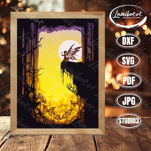 May include: A framed art piece featuring a fairy silhouette perched on a cliff, with a full moon and butterflies. The artwork is in a wooden frame, with a warm yellow and purple color scheme. The image includes the text "Lumiboxok".