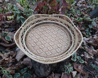 Two rattan round fruit trays Set of knitted bread pans Decorative