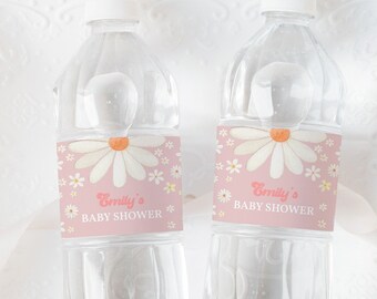 May include: Two clear plastic water bottles with pink and white daisy themed labels that say "Emily's Baby Shower".