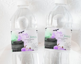 May include: Two clear plastic water bottles with labels featuring a cauldron, a pumpkin, and bats. The labels are green, purple, and black with the text "Emily and James's Gender Reveal Party Oct. 28, 2023".