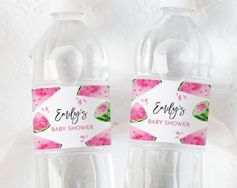 May include: Two clear plastic water bottles with pink and green watermelon themed labels that say "Emily's Baby Shower".