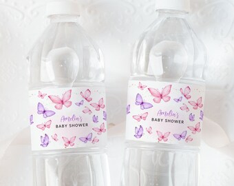 May include: Two clear plastic water bottles with pink and purple butterfly labels that say "Amelia's Baby Shower".