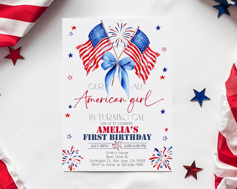 May include: A birthday invitation card with an American theme. It features two American flags, a blue bow, and star decorations. The text reads "Our American girl is turning one" and invites guests to Amelia's first birthday on July 28th.
