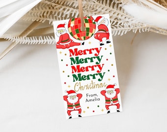May include: A white gift tag with a red and green Christmas theme. It features a disco ball, Santa Claus figures, and the text "Merry Merry Merry Merry Christmas" and "From, Amelia".