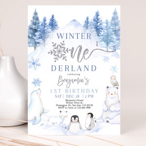 May include: A blue and white winter wonderland themed first birthday party invitation with a silver glitter snowflake and the text "Winter One Derland celebrating Benjamin's 1st Birthday". The invitation includes the date and time of the party, the address, and RSVP information.