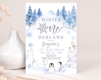 May include: A blue and white winter wonderland themed first birthday party invitation with a silver glitter snowflake and the text "Winter One Derland celebrating Benjamin's 1st Birthday". The invitation includes the date and time of the party, the address, and RSVP information.