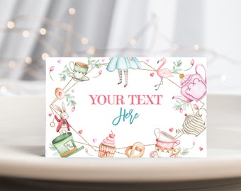 May include: A white card with a gold frame and a pink and blue Alice in Wonderland theme. The card has a space for text that says "YOUR TEXT Here".