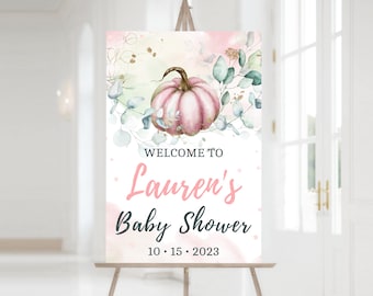 Puede incluir: Un cartel de bienvenida para un baby shower con un fondo de acuarela rosa y verde. El cartel presenta una calabaza rosa con hojas verdes y detalles dorados. El texto dice "Bienvenido al Baby Shower de Lauren 10.15.2023".