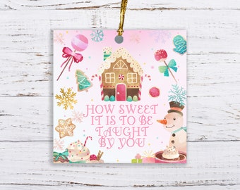 May include: Square ceramic ornament with a watercolor design featuring a gingerbread house, snowman, and sweets. The text "HOW SWEET IT IS TO BE TAUGHT BY YOU" is displayed on a pink background, perfect for a teacher's gift.