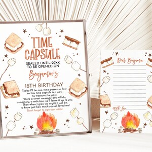 May include: A framed time capsule sign and a matching card. The sign reads "TIME CAPSULE" and "SEALED UNTIL 20XX TO BE OPENED ON Benjamin's 18TH BIRTHDAY." The card is lined and says "Dear Benjamin" and "With Love." Both feature s'mores and campfire illustrations.