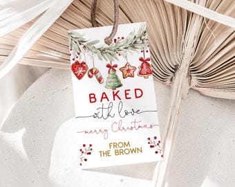 May include: A rectangular gift tag with a brown string, featuring the text "BAKED with love merry Christmas FROM THE BROWN" in red and black. The tag is decorated with watercolor illustrations of Christmas cookies and greenery.