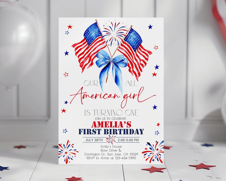 May include: A white invitation card with a patriotic theme. It features two American flags, a blue bow, and the text "Our American girl is turning one." The card includes details for Amelia's first birthday, with red and blue accents.