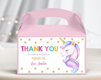 May include: Pink favor box with a unicorn design and gold glitter stars. The box has a handle and says "Thank you for making my party so magical. Love, Amelia."
