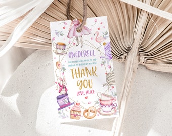 May include: A white thank you tag with gold glitter text that says "ONEDERFUL" and "THANK YOU". The tag is decorated with watercolour illustrations of Alice in Wonderland characters, including Alice, the Mad Hatter, the White Rabbit, a flamingo, and teacups.