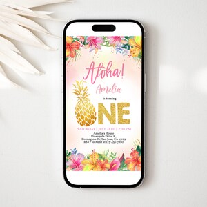 May include: A digital invitation for a first birthday party with a tropical theme. The invitation features a pineapple with gold glitter, the words "Aloha! Amelia is turning ONE", and tropical flowers. The invitation also includes the date, time, and location of the party.