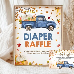 May include: A framed sign and matching card with a watercolor illustration of a blue pickup truck carrying pumpkins. The sign reads "DIAPER RAFFLE" with additional text. Autumn leaves and pumpkins decorate the design.