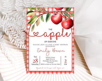 May include: Baby shower invitation with a red and white gingham border. The invitation features the text "The Apple of Our Eye" with a watercolor illustration of red apples and green leaves. Details include the date, time, and location.