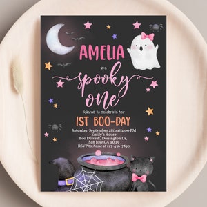 May include: A black and white invitation card with a pink and white ghost, a cauldron, and a black cat. The text on the card reads "Amelia is a Spooky One" and "1st Boo-Day".