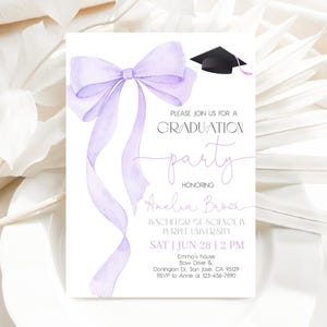May include: Purple graduation party invitation with a watercolor bow and a graduation cap. The invitation reads "Please join us for a graduation party honoring Amelia Brook, Bachelor of Science in Purple University, Sat | Jun 28 | 2 PM, Emma's house, Bow Drive & Donington Dr. San Jose, CA 95129, RSVP to Anne at 123-456-7890."