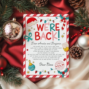 May include: A festive Christmas letter with the words "WE'RE BACK!" in colorful text. The letter is decorated with holiday-themed illustrations, including a Santa hat, candy cane, and ornaments. The letter is addressed to Amelia and Benjamin.