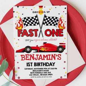 May include: A red, white and black birthday invitation with a red racing car and chequered flags. The text reads "Growing Up Fast One, start your engines and come celebrate! Benjamin's 1st Birthday. Saturday, November 19th at 2:00 PM, Benjamin's House, 5678 Formula One Ave, Las Vegas, Nevada 89109, RSVP to Olivia at 123-456-7890."