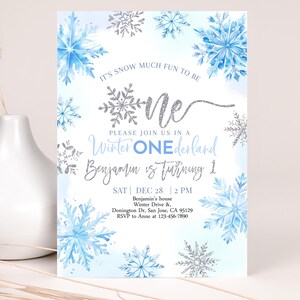 May include: A blue and silver snowflake themed first birthday party invitation with the text "It's snow much fun to be one. Please join us in a Winter Onederland. Benjamin is turning 1. Sat Dec 28, 2 PM. Benjamin's house, Winter Drive & Donington Dr. San Jose, CA 95129. RSVP to Anne at 123-456-7890."