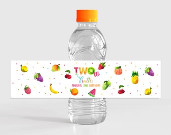 May include: Water bottle label with a colorful fruit design. The label says "Two-tti Frutti Amelia's 2nd Birthday".