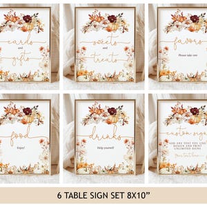 May include: Set of six framed table signs with fall-themed floral arrangements and text. The signs read "cards and gifts," "sweets and treats," "favors," "food," "drinks," and "custom sign." Each sign is 8x10 inches.