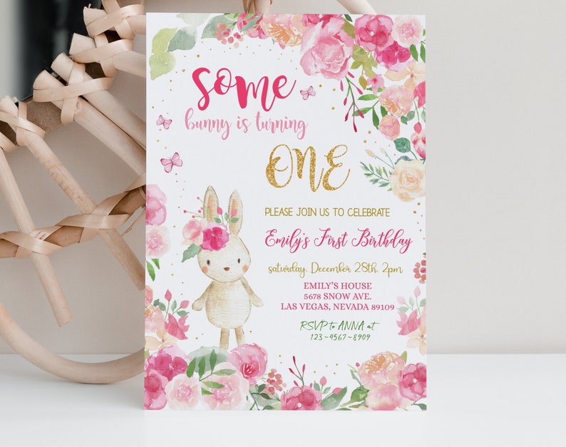 May include: A pink and gold first birthday invitation with a watercolor floral design and a cute bunny rabbit. The invitation says "Some bunny is turning one" and includes the details of the party, including the date, time, and location. RSVP to Anna at 123-4567-8909.