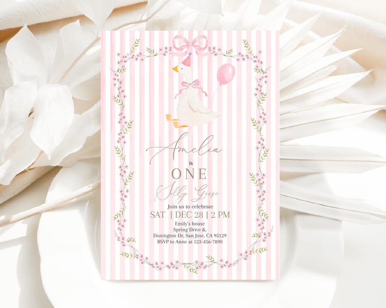 May include: A pink and white striped invitation with a watercolor illustration of a goose wearing a party hat and holding a balloon. The invitation reads "Amelia is ONE Silly Goose" and includes event details.