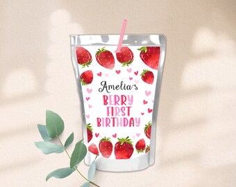 May include: A white juice pouch with a pink straw. The pouch has a strawberry pattern and the text "Amelia's Berry First Birthday".