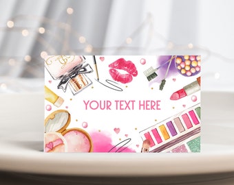 Op de afbeelding: Een aquarel illustratie van make-up producten, waaronder lippenstift, oogschaduw, parfum en blush. De tekst "YOUR TEXT HERE" is roze. Het ontwerp bevat roze hartjes en gouden accenten.